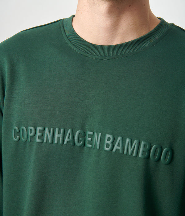 Grönt joggingset i bambu med logotyp